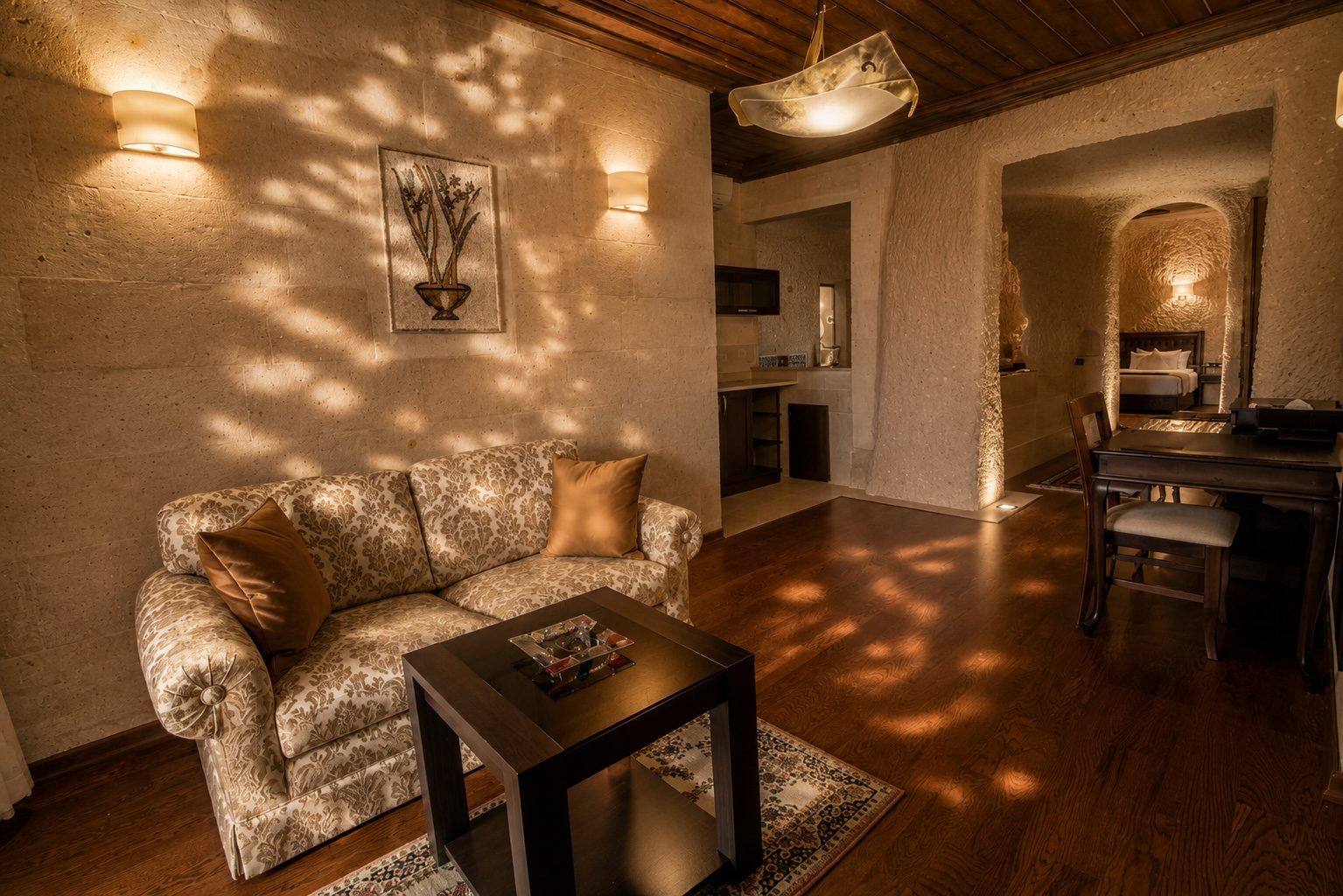 Suite living room with sofa and desk in late afternoon light